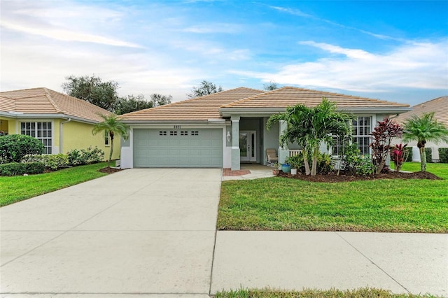 single story home featuring a garage and a front lawn