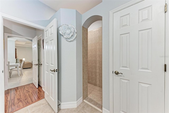 corridor featuring light tile patterned floors