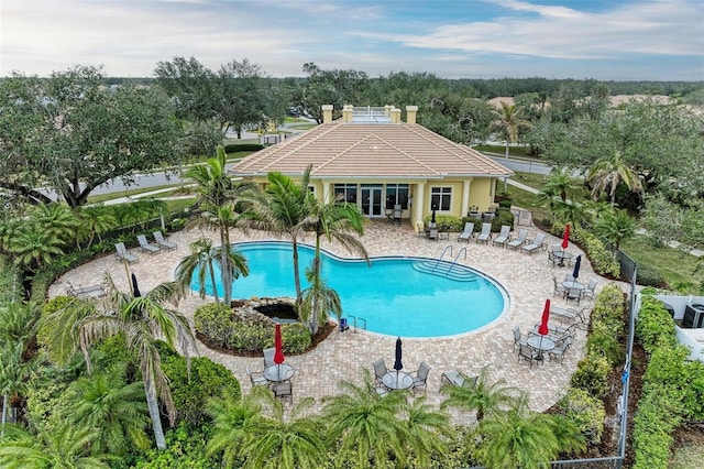 view of swimming pool featuring a patio