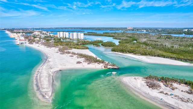 birds eye view of property with a view of the beach and a water view