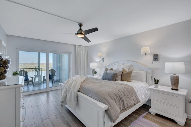 bedroom featuring ceiling fan, wood-type flooring, and access to outside