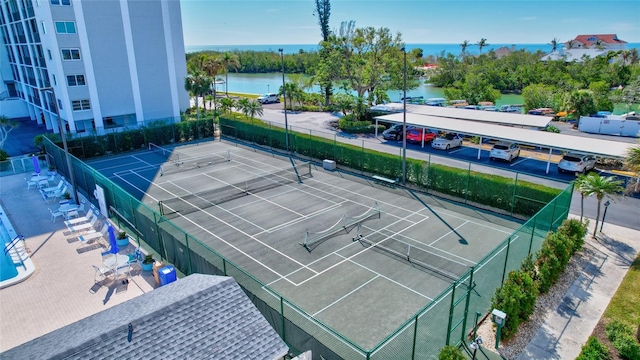 birds eye view of property with a water view