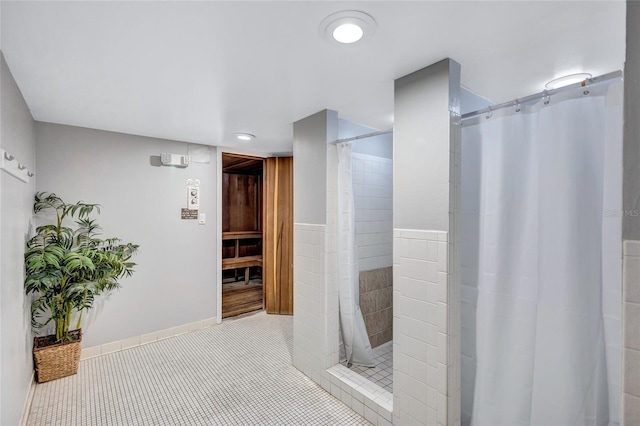 bathroom featuring tile patterned floors and walk in shower