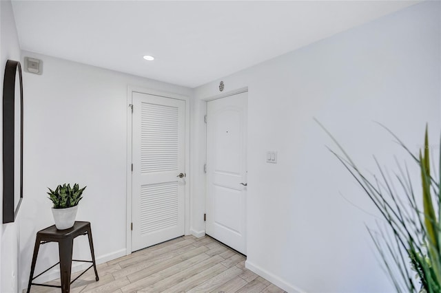 corridor featuring light hardwood / wood-style floors