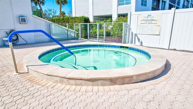 view of pool featuring a hot tub