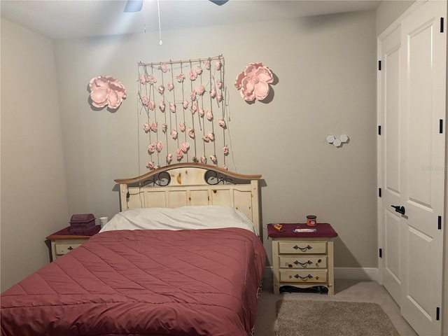 carpeted bedroom featuring ceiling fan