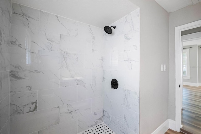 bathroom with tiled shower