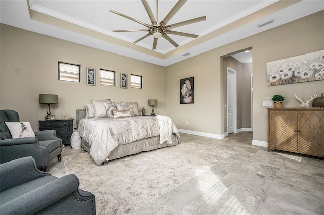 bedroom featuring crown molding, a tray ceiling, and ceiling fan