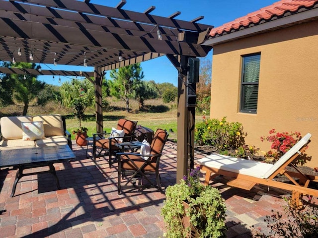 view of patio with an outdoor hangout area and a pergola