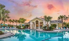 view of pool at dusk