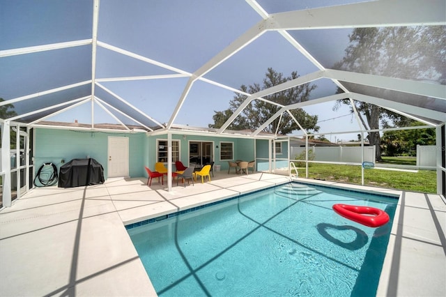 view of pool featuring a patio, area for grilling, and glass enclosure