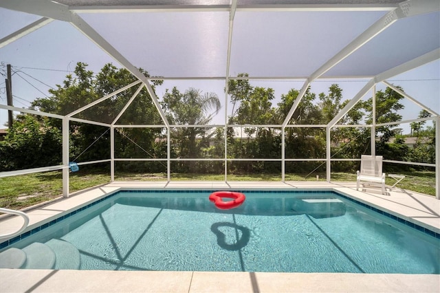 view of swimming pool with a lanai and a patio area