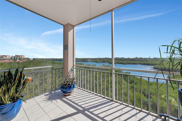 unfurnished sunroom with a water view