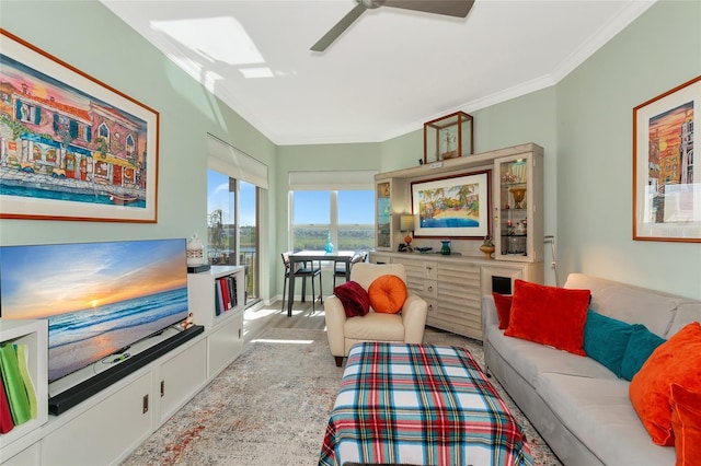 living room with light carpet, crown molding, and ceiling fan