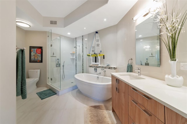 full bathroom featuring vanity, shower with separate bathtub, and toilet