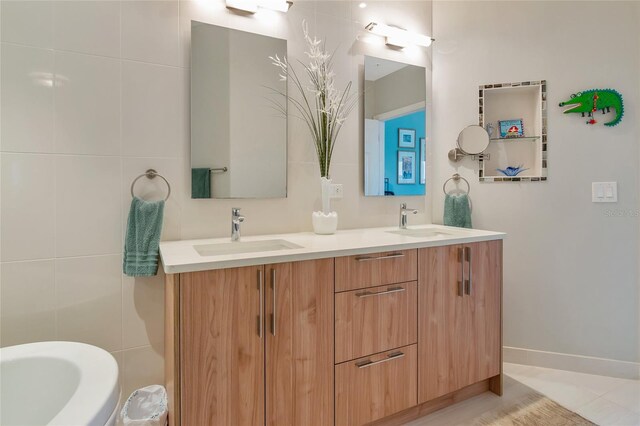 bathroom featuring vanity and a tub