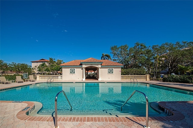 view of swimming pool featuring a patio area