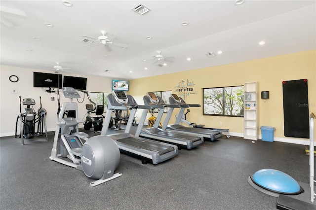 gym with lofted ceiling and ceiling fan