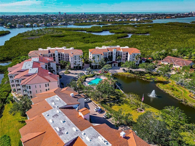 birds eye view of property with a water view