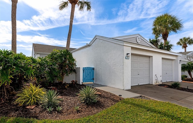 view of side of property featuring a garage