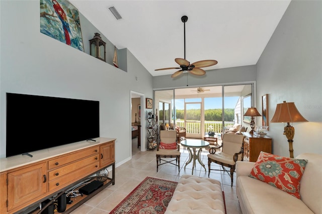 living room with ceiling fan, high vaulted ceiling, and light tile patterned floors