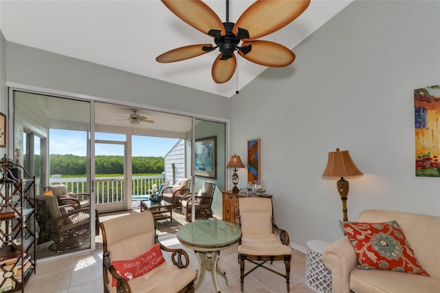 tiled living room with vaulted ceiling and ceiling fan