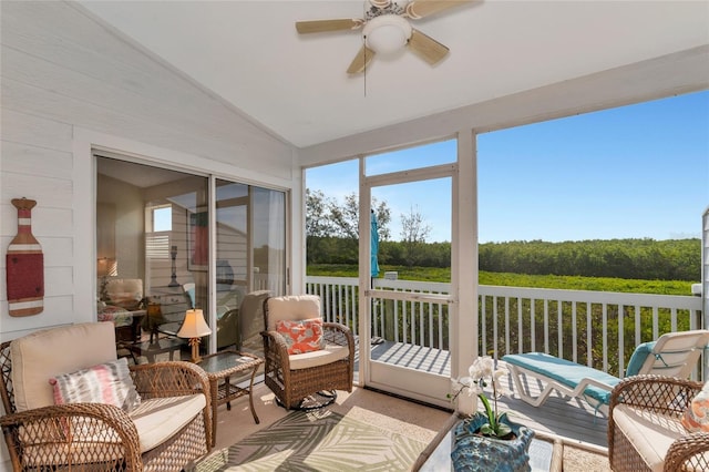 sunroom with vaulted ceiling and ceiling fan