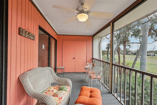 sunroom with ceiling fan and plenty of natural light