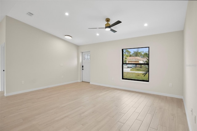 spare room featuring ceiling fan and light wood-type flooring