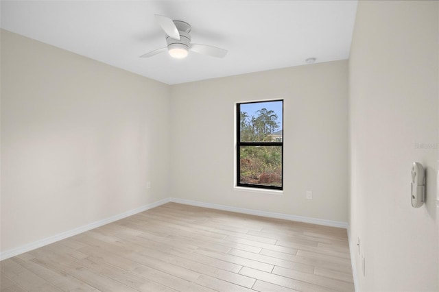 unfurnished room featuring light hardwood / wood-style flooring and ceiling fan