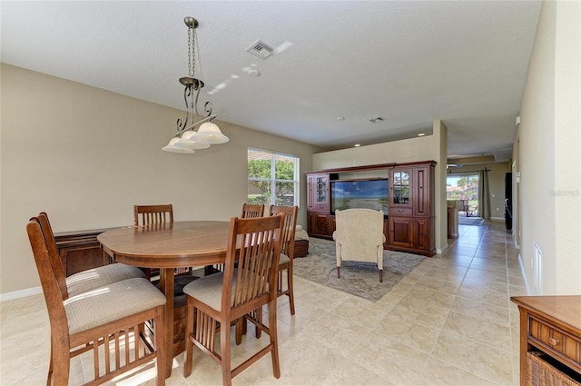 dining space with light tile patterned floors