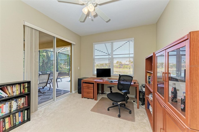 carpeted office with ceiling fan