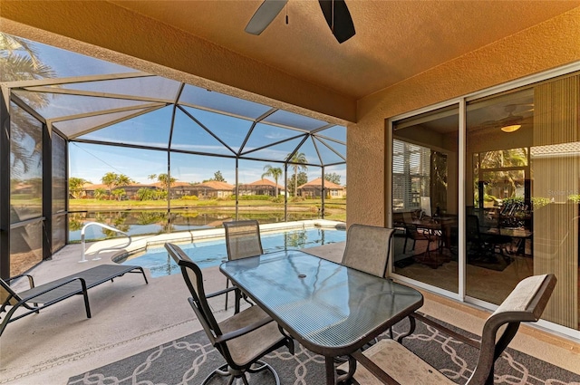 view of patio with a lanai and ceiling fan