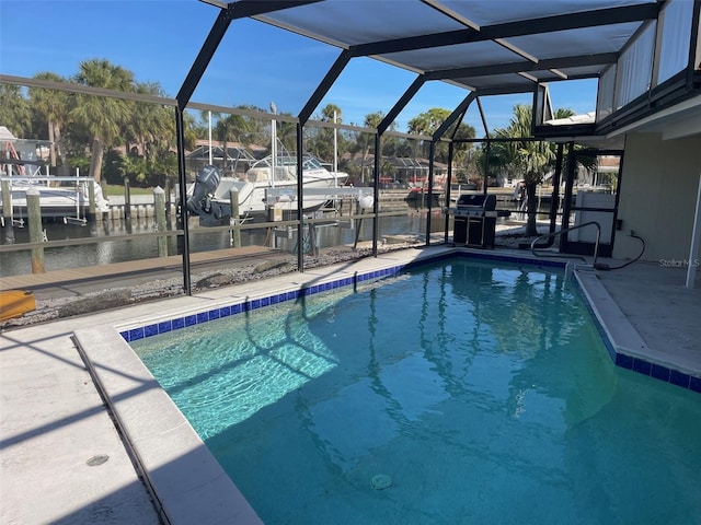 view of swimming pool featuring a lanai, grilling area, a boat dock, and a water view