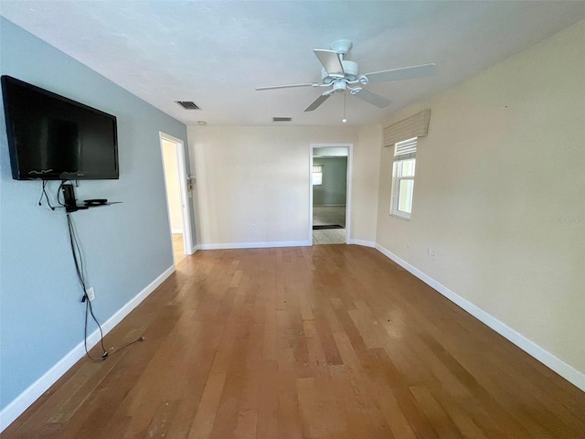 interior space with ceiling fan and light hardwood / wood-style floors