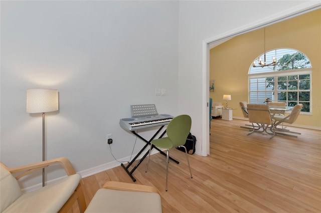 office featuring wood-type flooring and a chandelier