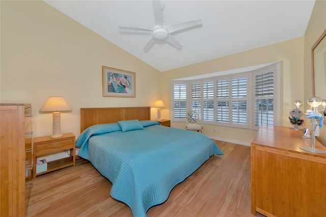 bedroom with wood-type flooring, vaulted ceiling, and ceiling fan