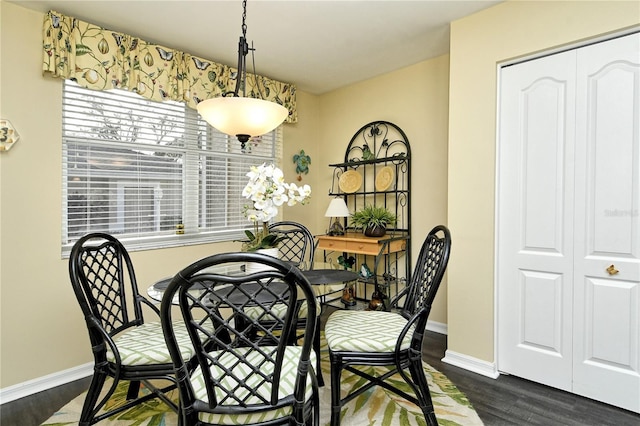 dining room with dark wood-type flooring