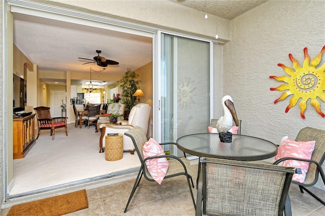 view of patio featuring ceiling fan