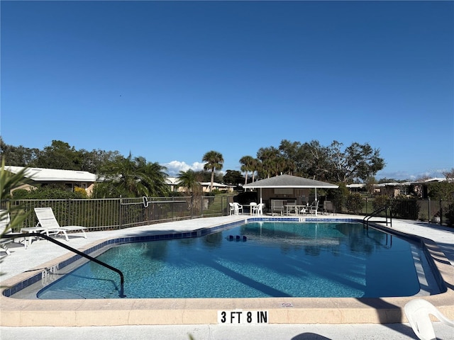 view of swimming pool featuring a gazebo and a patio