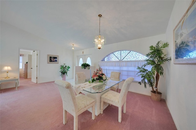 dining room featuring carpet, lofted ceiling, and a chandelier