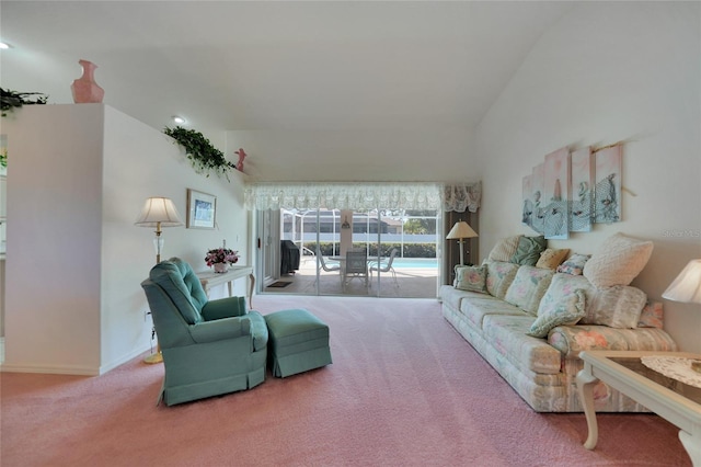 living room featuring carpet floors and vaulted ceiling