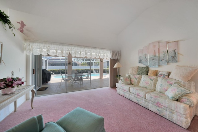 carpeted living room with lofted ceiling