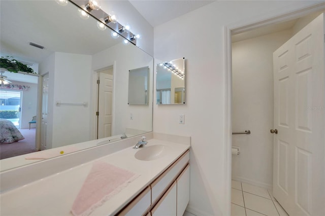 bathroom featuring tile patterned flooring and vanity