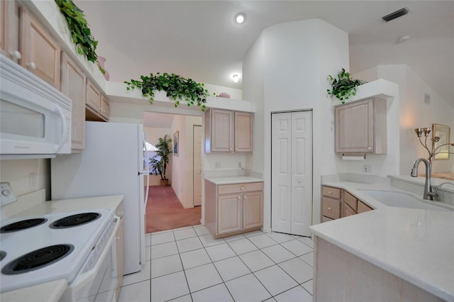 kitchen featuring sink, light brown cabinets, white appliances, and light tile patterned floors