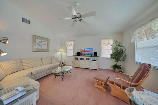 living room with vaulted ceiling, carpet flooring, and ceiling fan