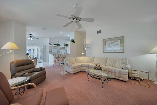 carpeted living room featuring lofted ceiling and ceiling fan