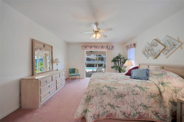 bedroom featuring access to outside, light colored carpet, and ceiling fan