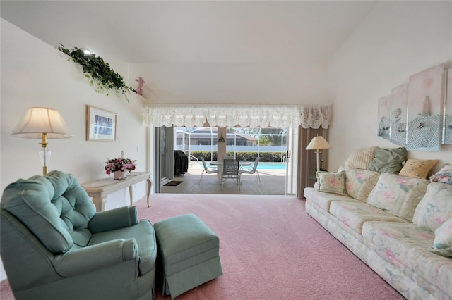 living room with a high ceiling and carpet floors