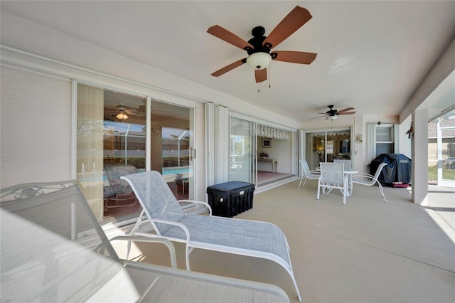 view of patio / terrace with ceiling fan and grilling area